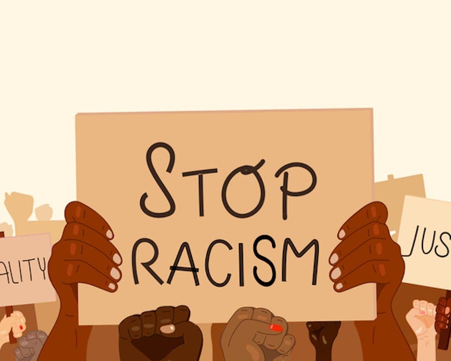 Image with sign that says stop racism. 