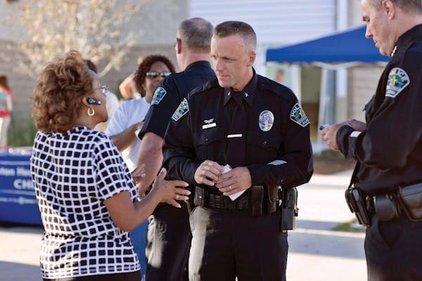 Photo of police officer talking with citizen. 